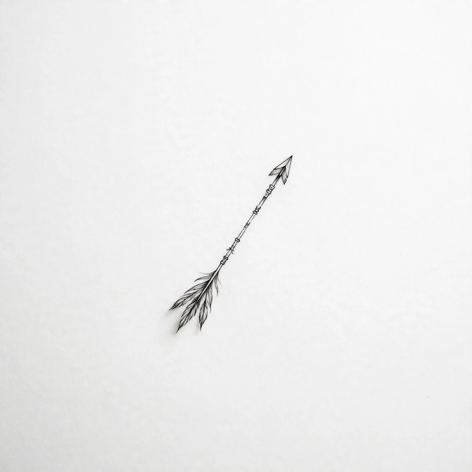 Tiny arrow tattoo - small meaningful tattoo idea