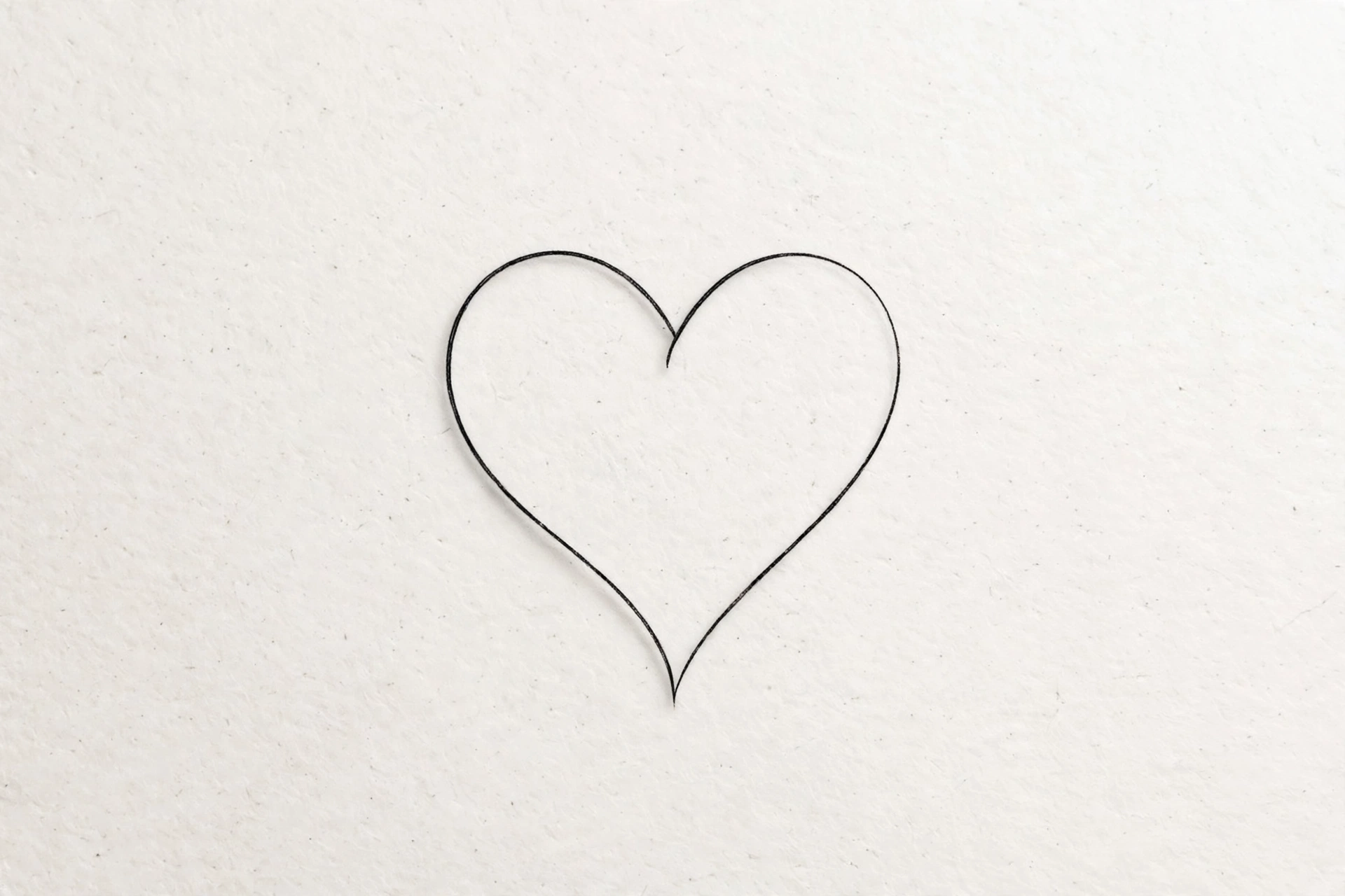 Single-line heart tattoo - small meaningful tattoo idea