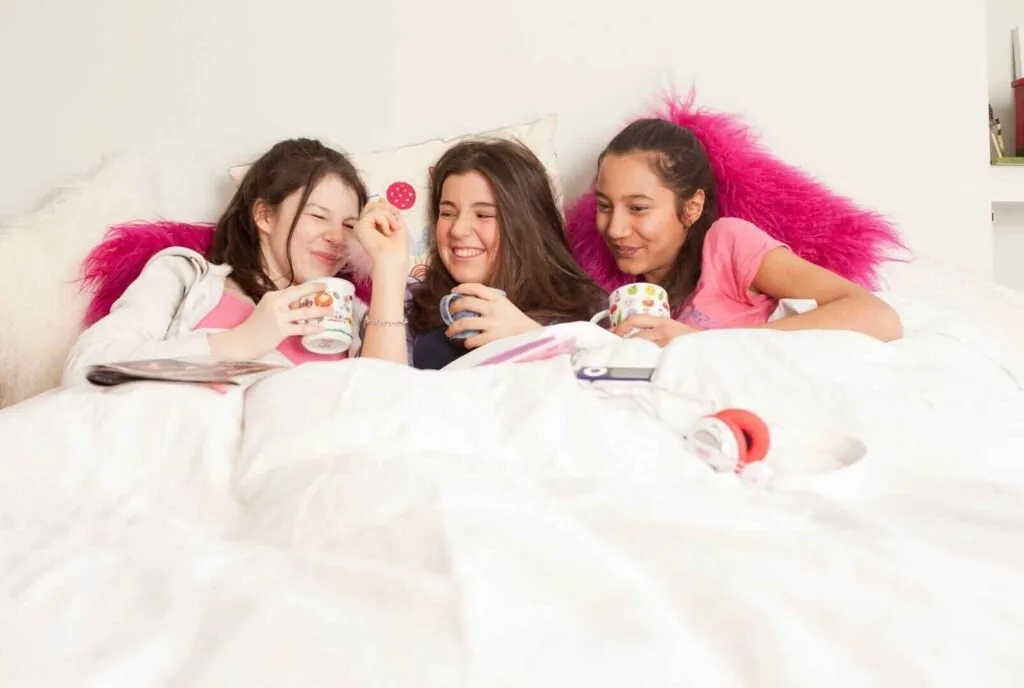 Family stargazing with blankets during a sleepover night