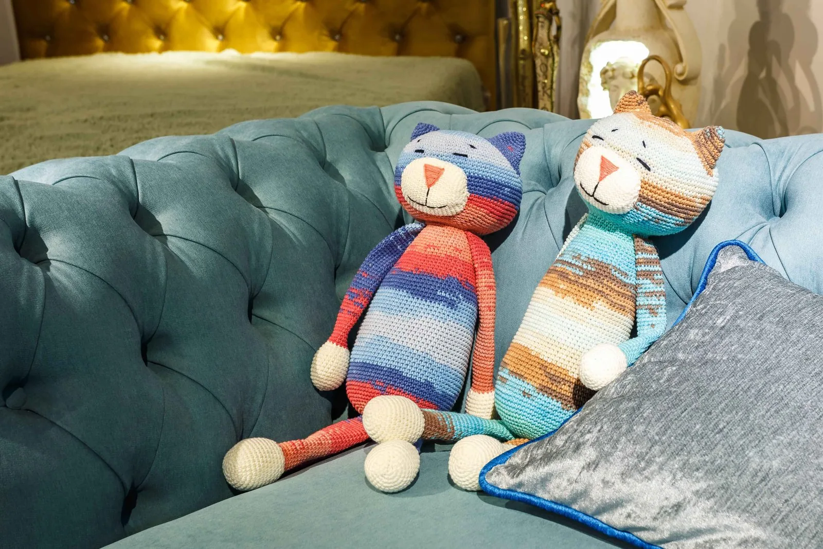 Collection of Hello Kitty plush toys arranged on a bed