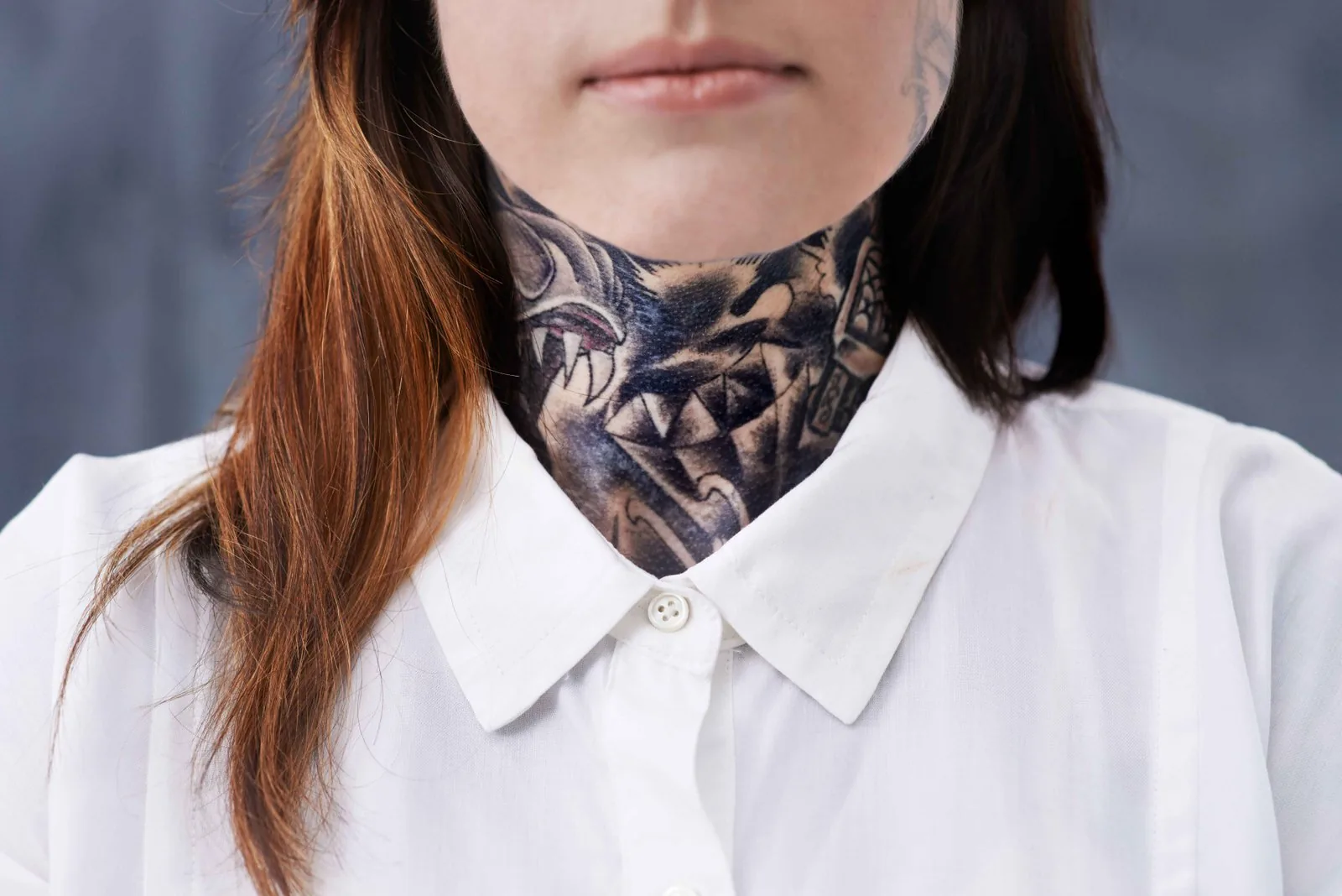 Young man with bold name neck tattoo