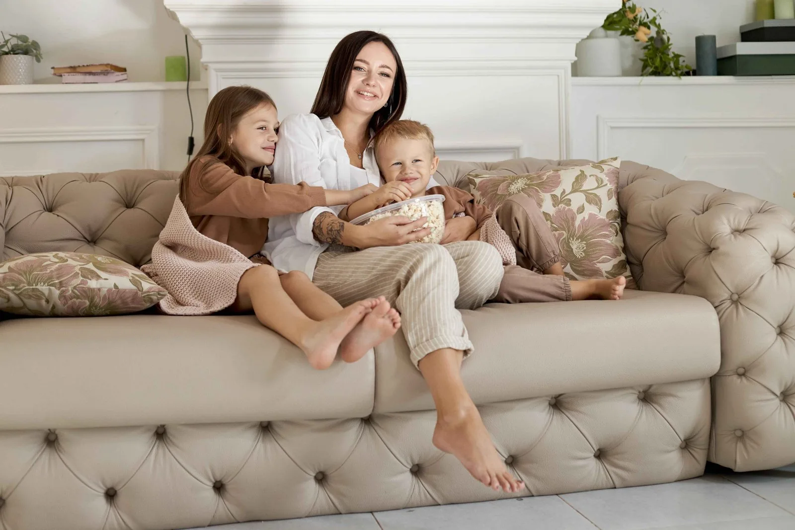 Elegant camelback sofa with arched back in a classic interior
