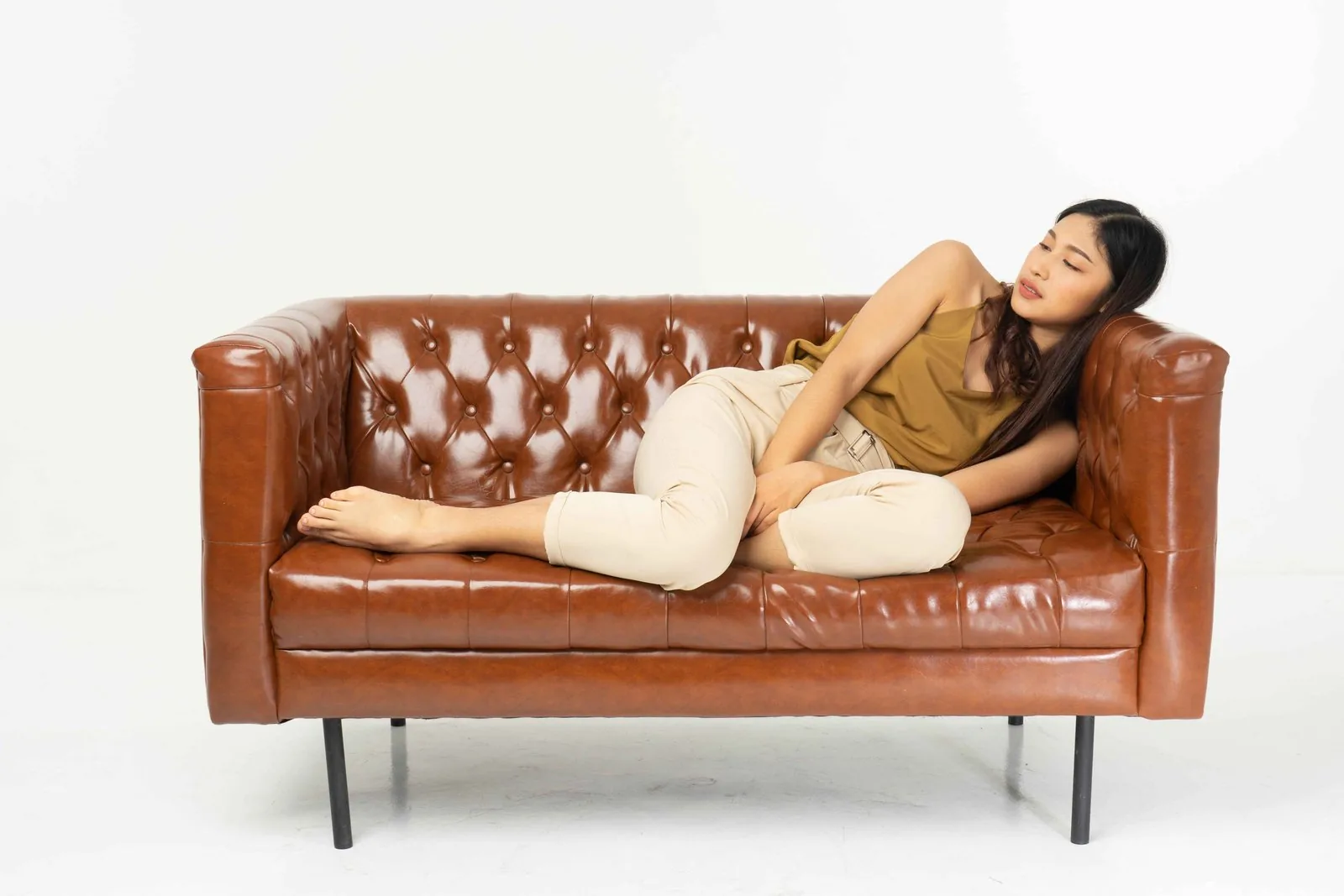 Reclining sofa with built-in footrests in a home theater setup