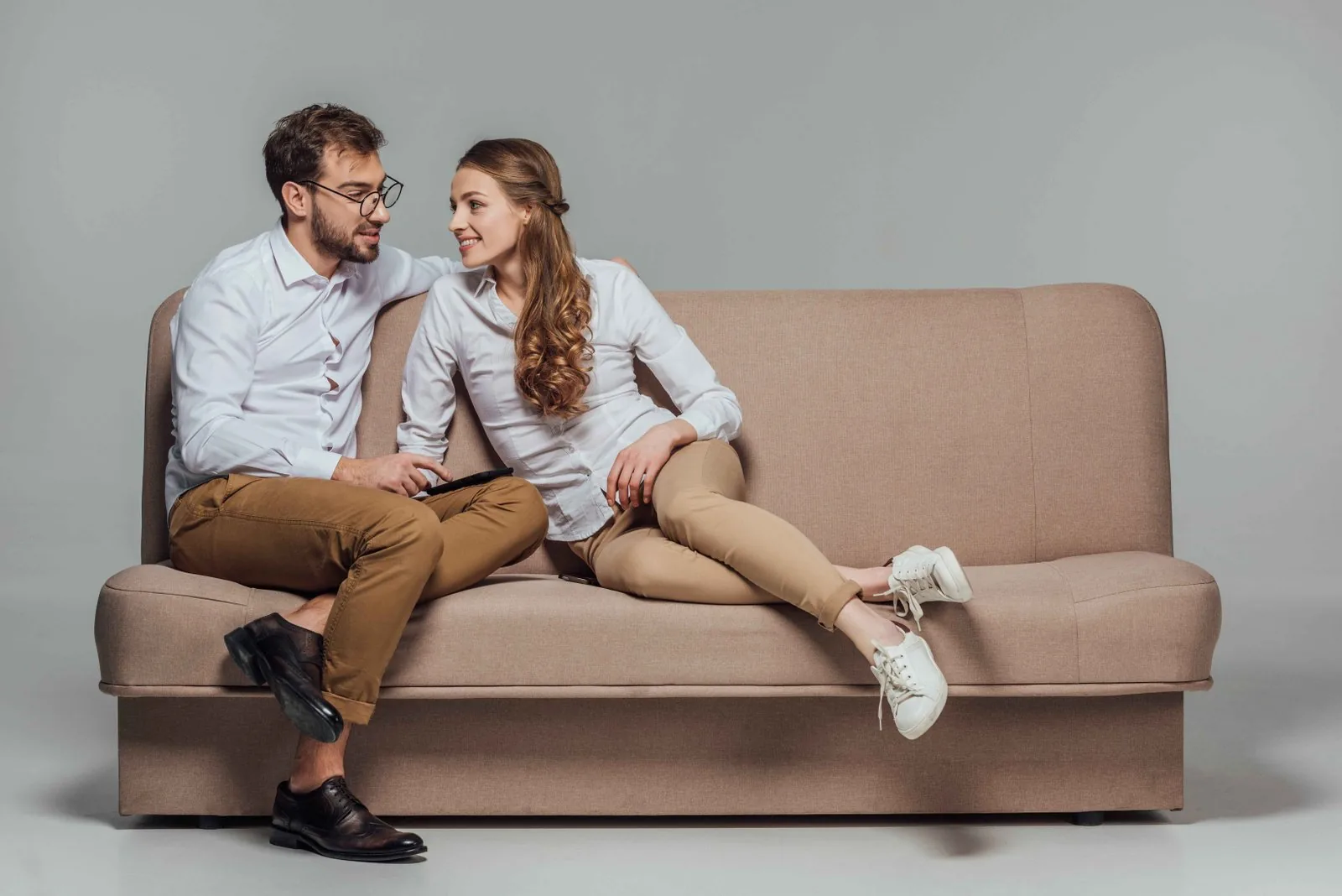 Compact loveseat paired with armchairs in a small living room