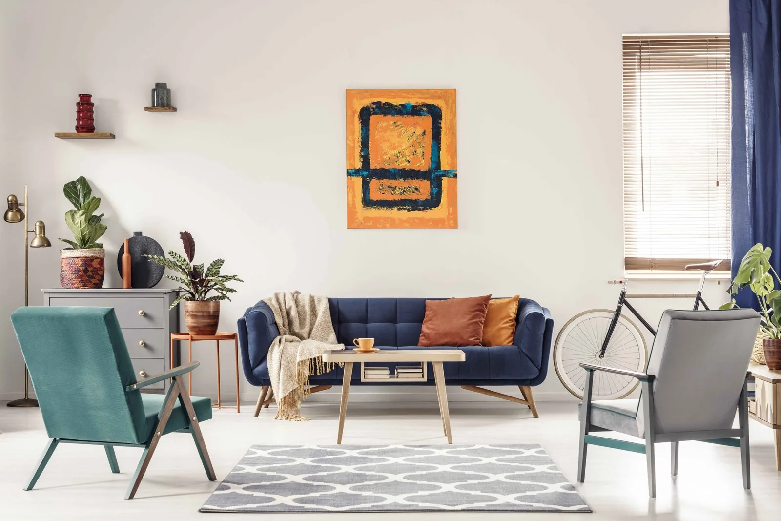 Wingback sofa with tall back and side wings by a fireplace