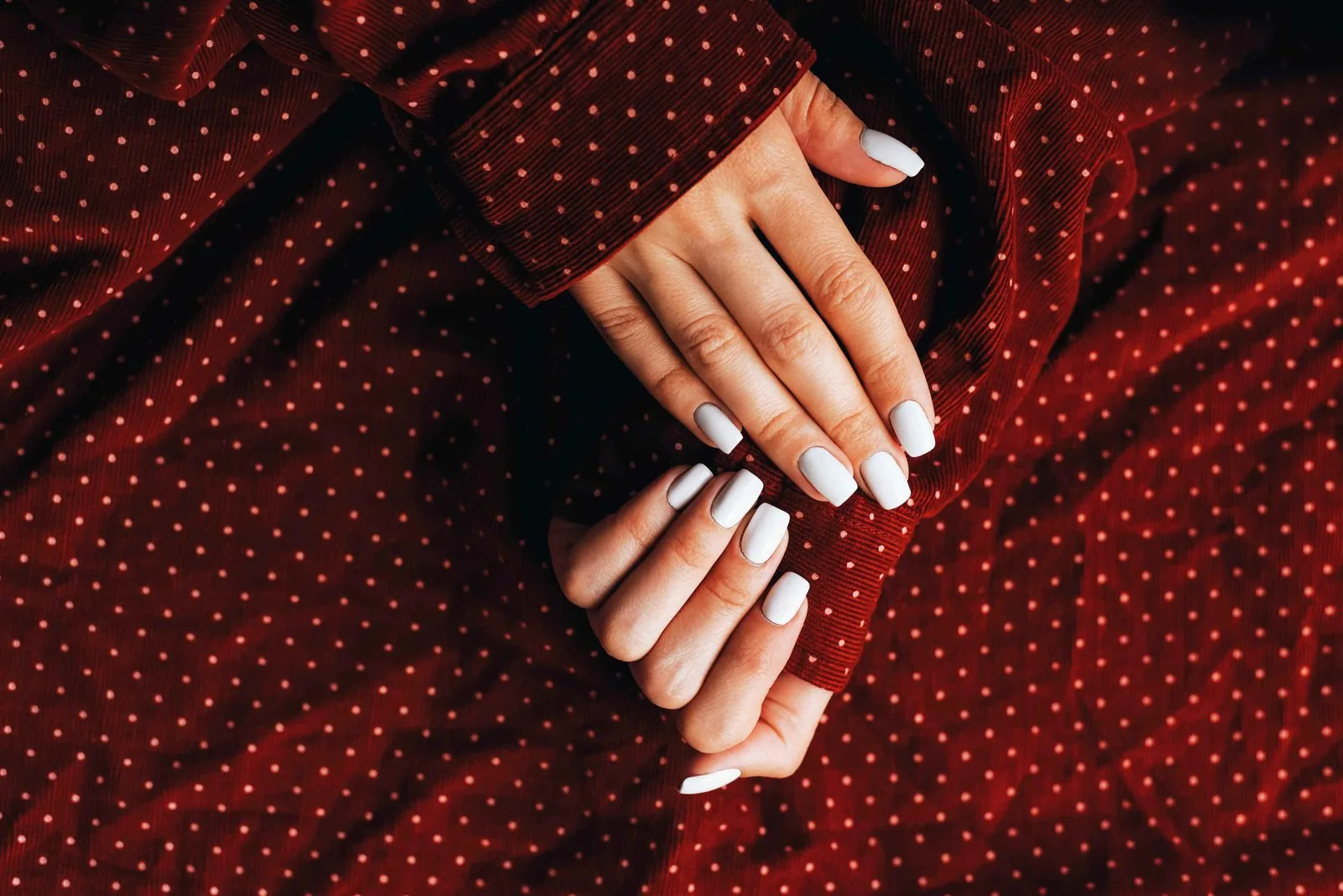 Bright glossy white polish on short elegant nails