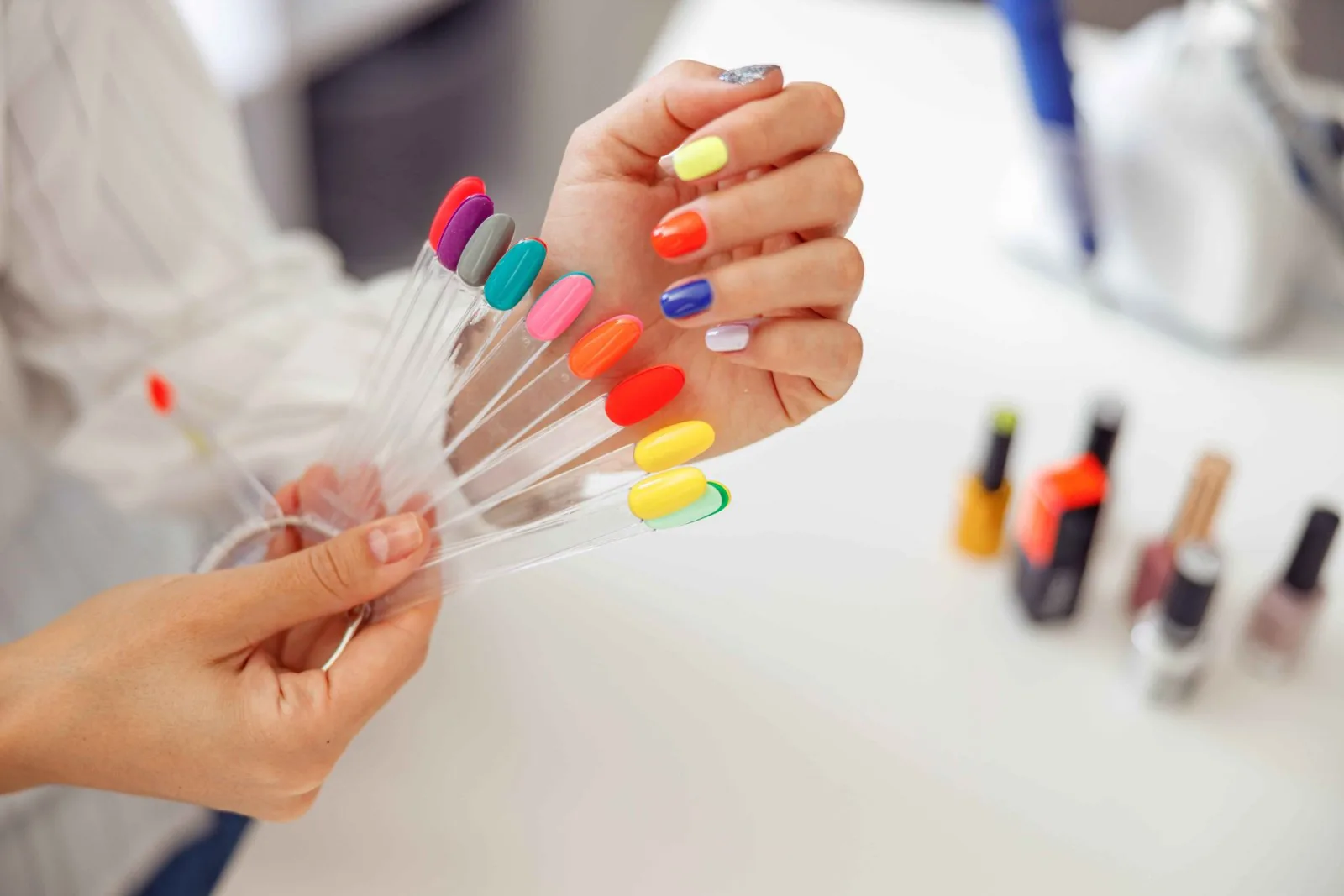 Color blocking nail design with white tips and bright colors