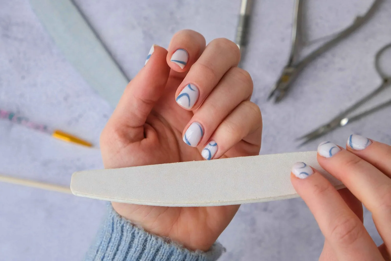 White marble nail design with grey veining
