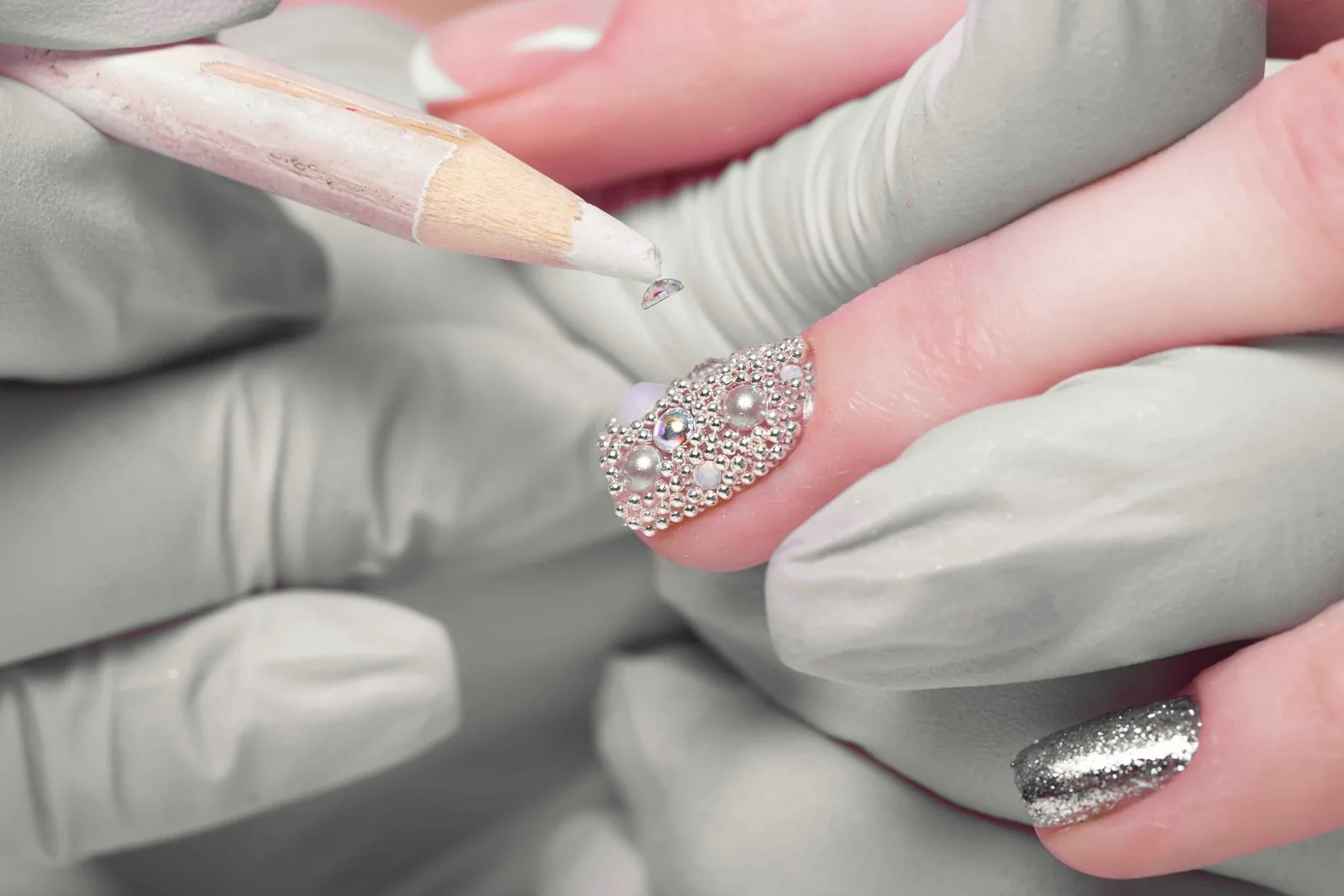 White glitter nail manicure with sparkling finish