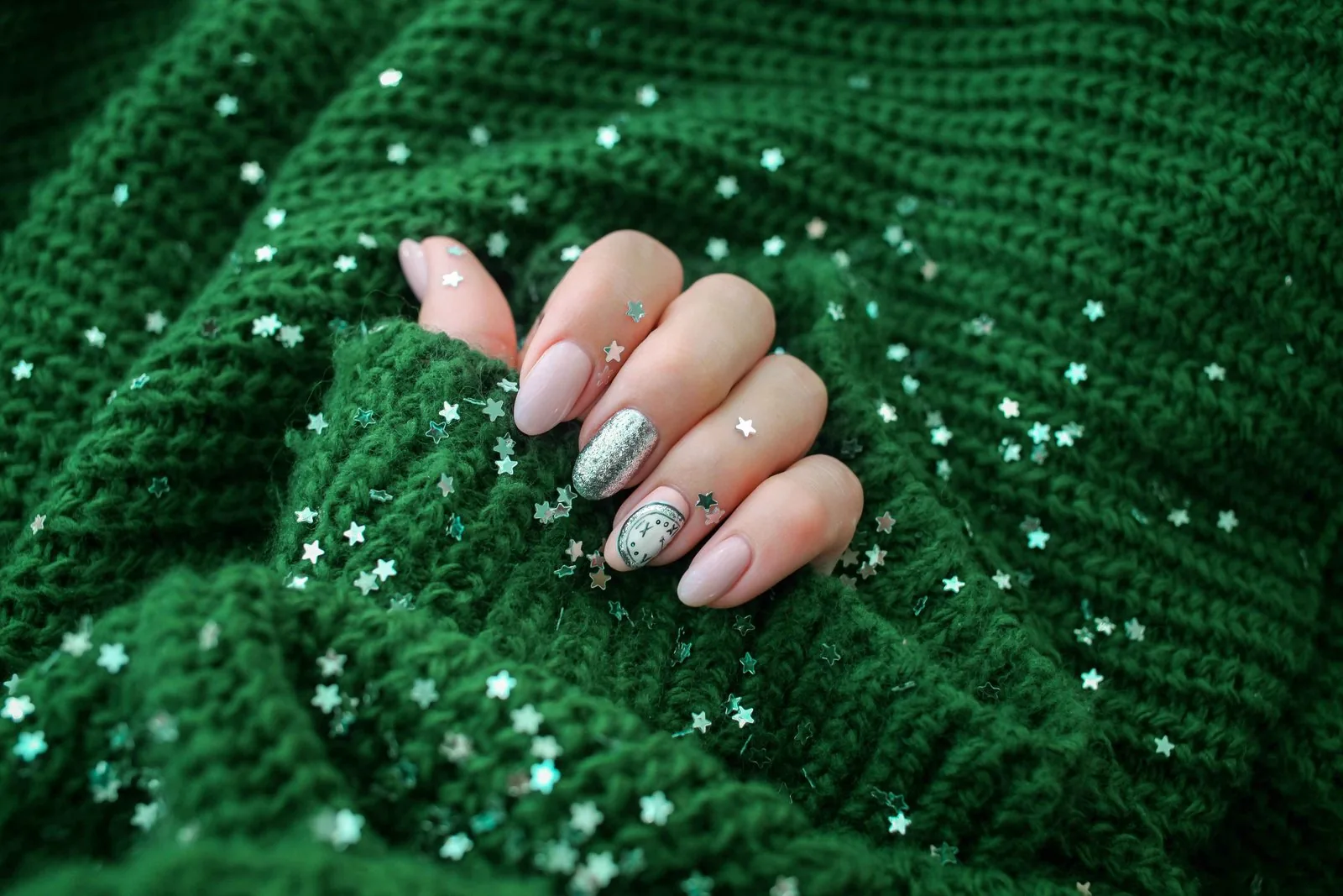 Winter white shimmer nails with a cozy sweater