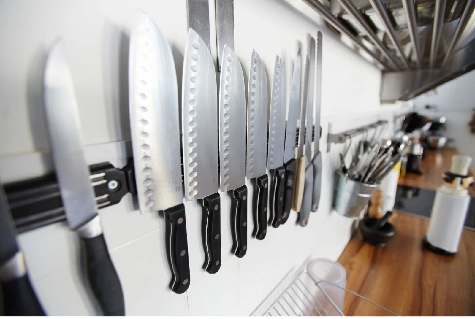 Clean kitchen knives stored properly in a wooden knife block