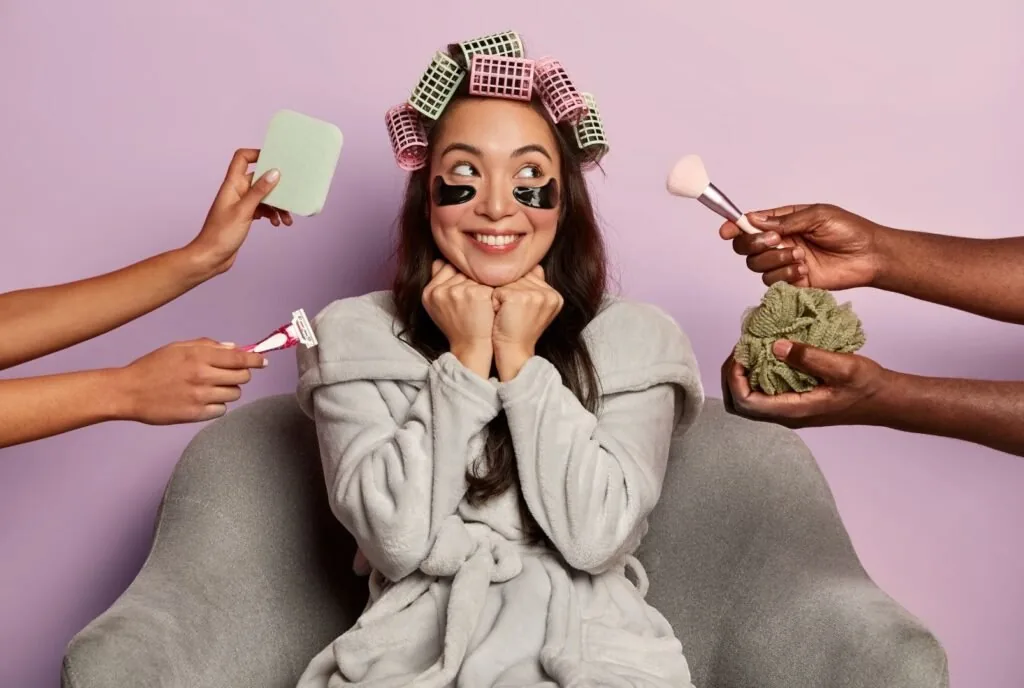 Makeup artist prepping skin with moisturizer before applying makeup