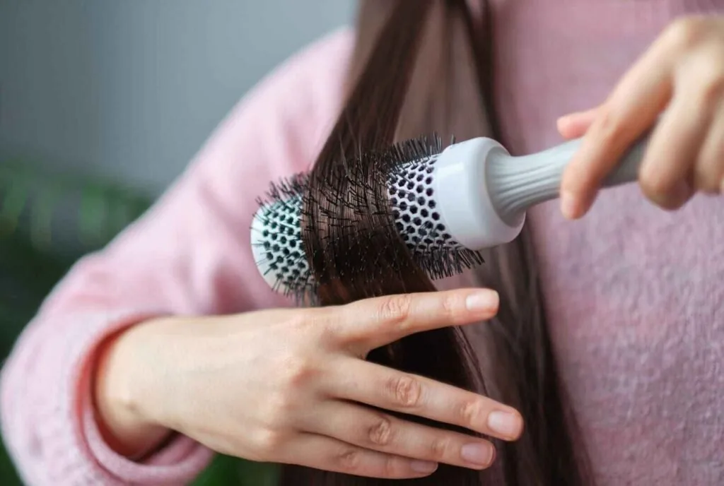 Fixing makeup mistakes with concealer and brush