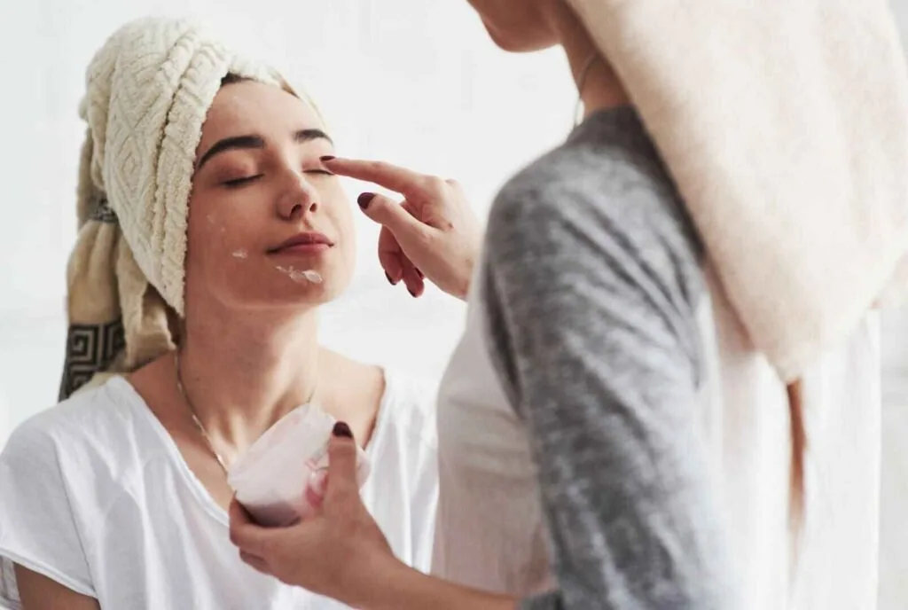 Woman following a simple morning skincare routine