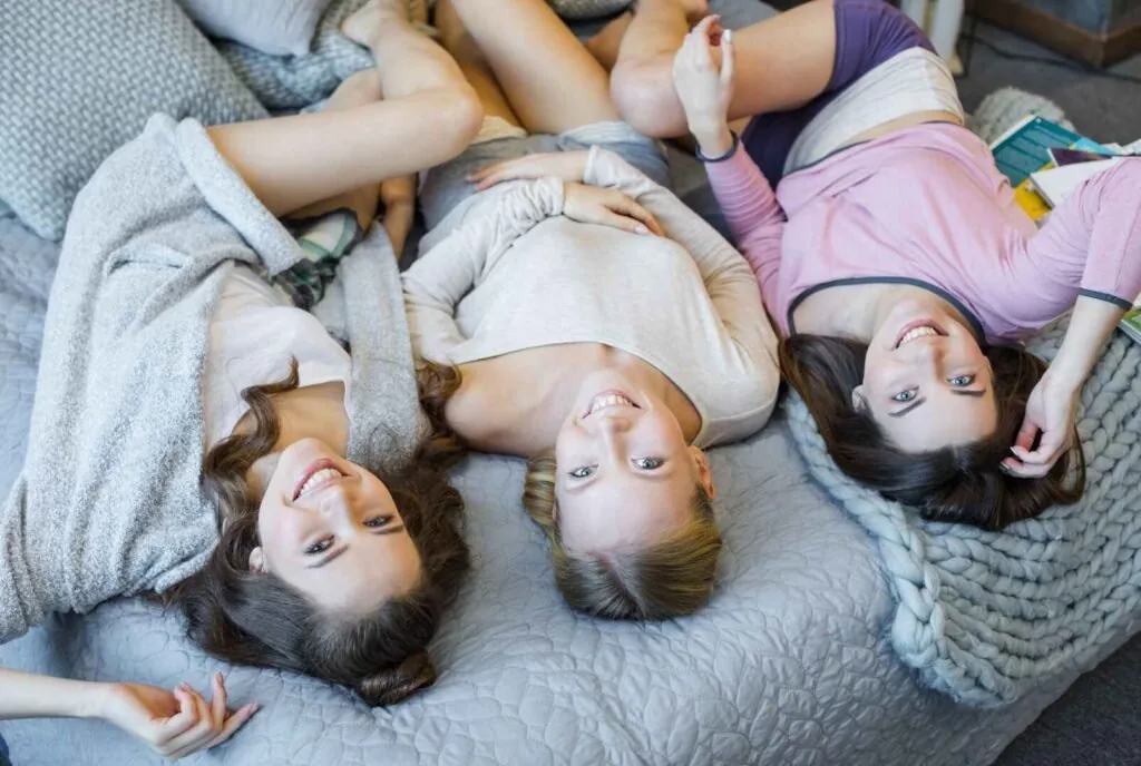 Friends taking fun photos at a girls sleepover